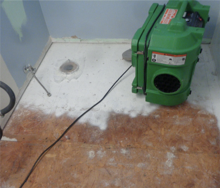 Exposed particle board subfloors exposed that has been treated with an anti mold agent and air scrubber 